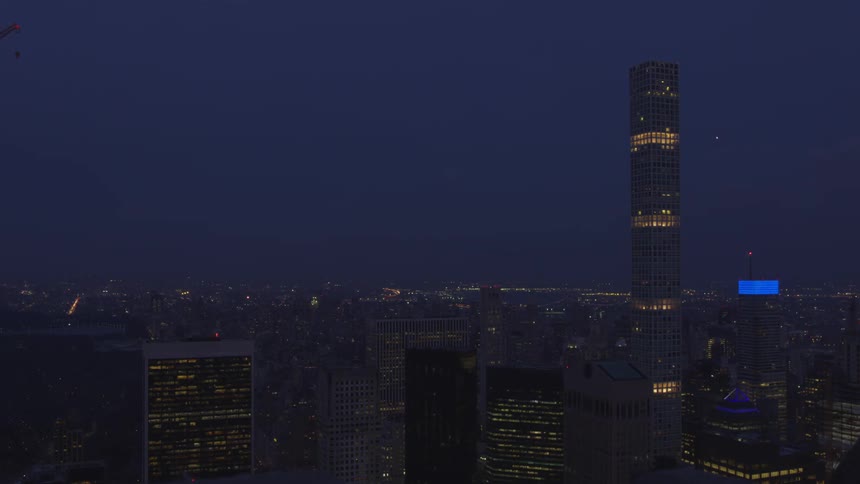 The sky is dark above the downtown city