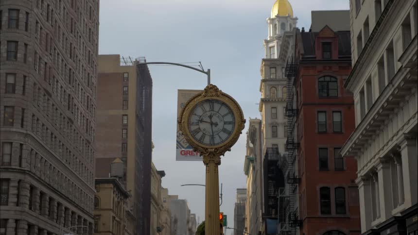 Clock in city square clicks ahead in timelapse mode
