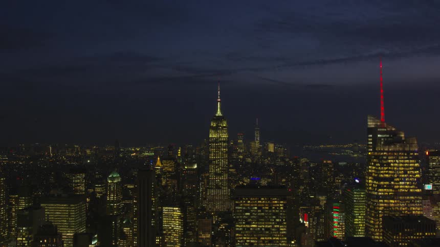 Time lapse of tall city towers at night