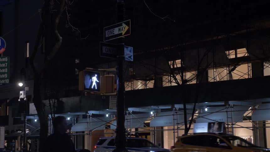 Crossing light on city street at night