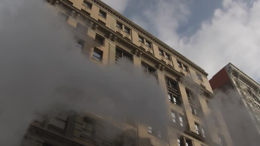 Smoke overtakes the brick buildings