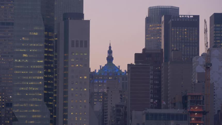 A city skyline over the course of a day