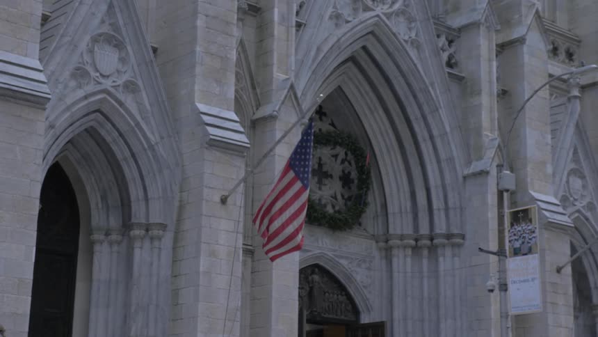 Historic building with american flag waving out front