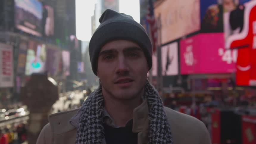 A man stares forward standing down in new york city