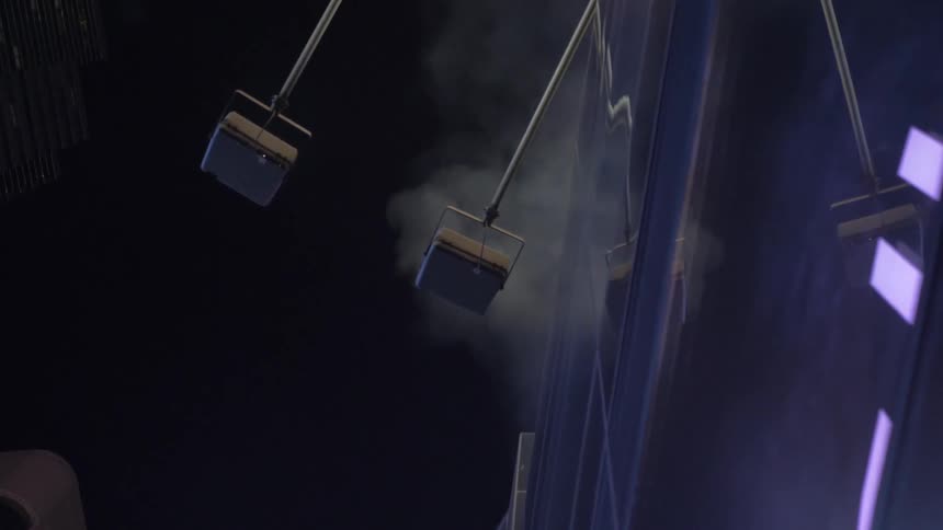 Birds eye view of the side of a building with lights on it