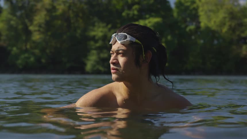 A man wading in a lake