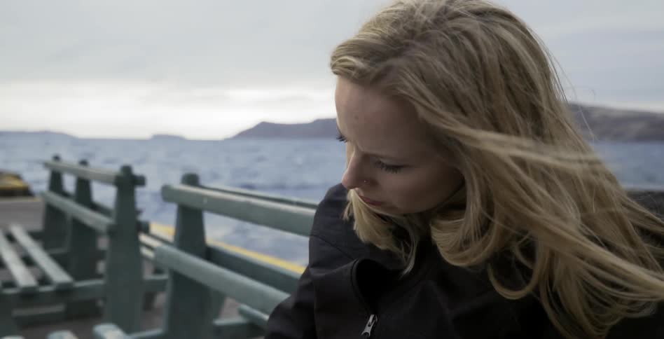 A woman is riding a ferry