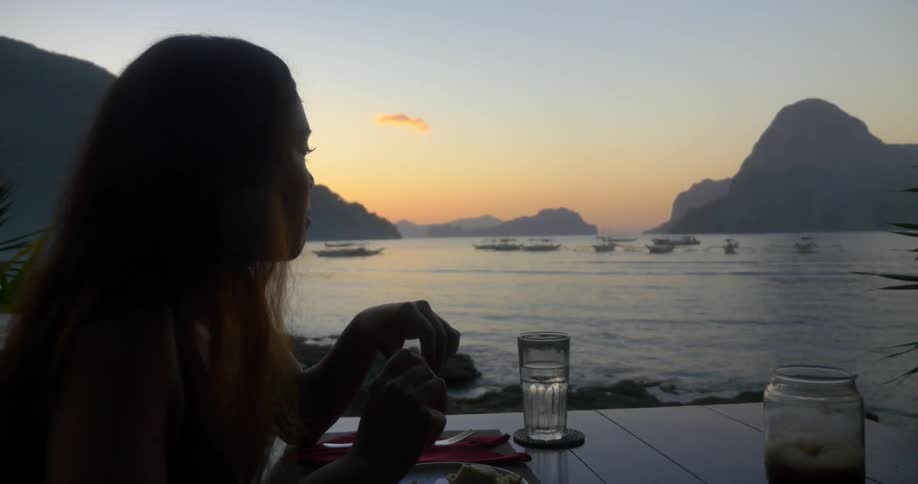 A person eating outdoors