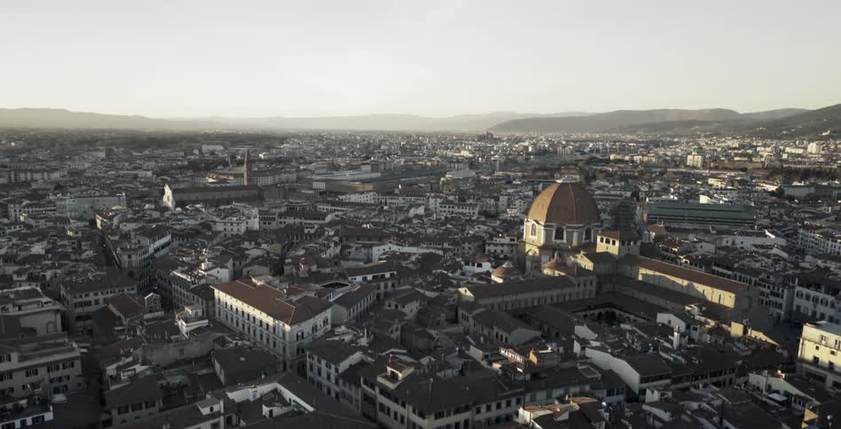 A domed building rests above the city skyline on a sunny day