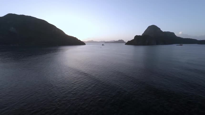 View of a large body of water with some hills poking out of it