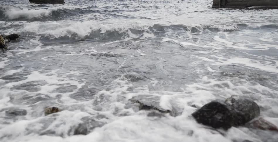 Waves of water crash upon the rocks