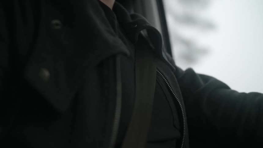A man wearing a seat belt