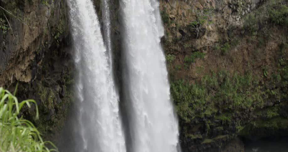 A waterfall cascades over a cliff