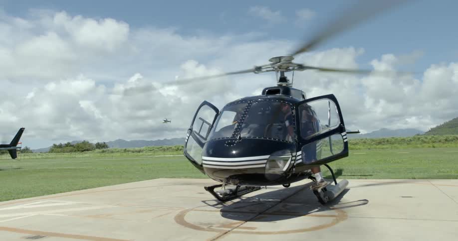 Man readies a helicopter for take off