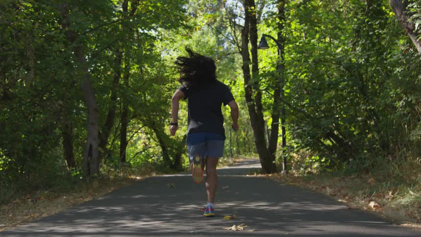 A man running in the park in the daytime