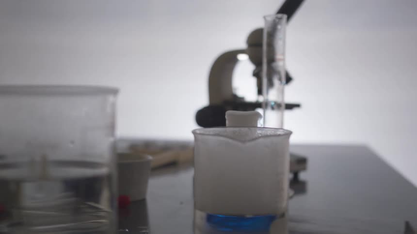 A bubbling test tube sitting in a laboratory