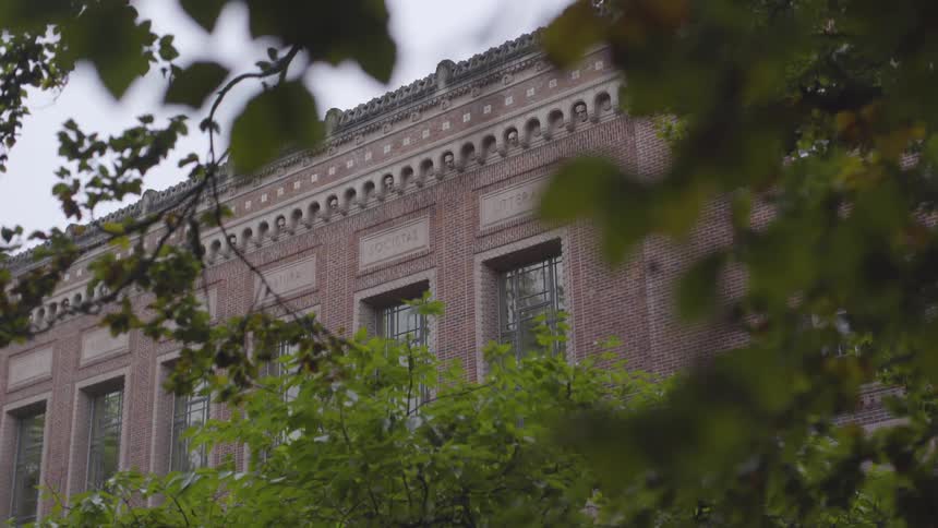 A building that is made out of brick on a college campus