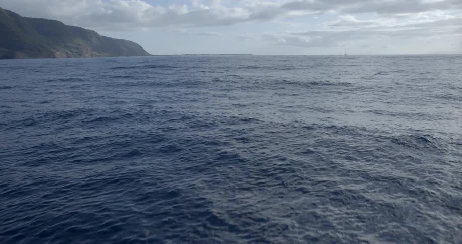 Water flows in the ocean on a cloudy day