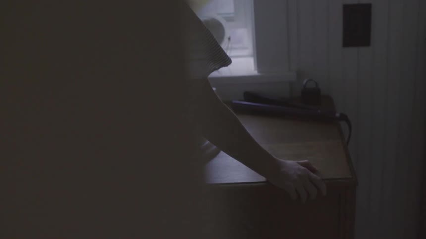 Girl standing next to a sink