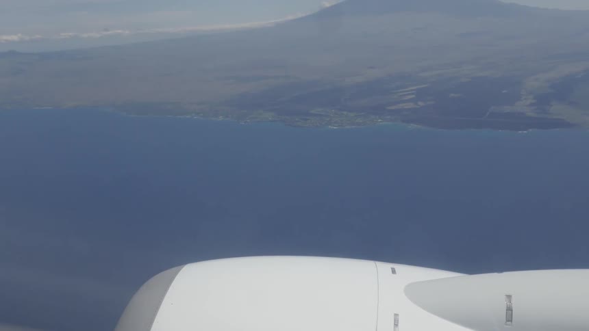 Earth's coastline across the blue sea on a sunny day