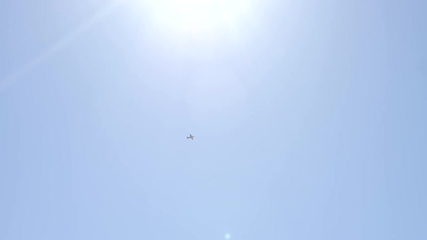 Glaring sun in clear blue sky