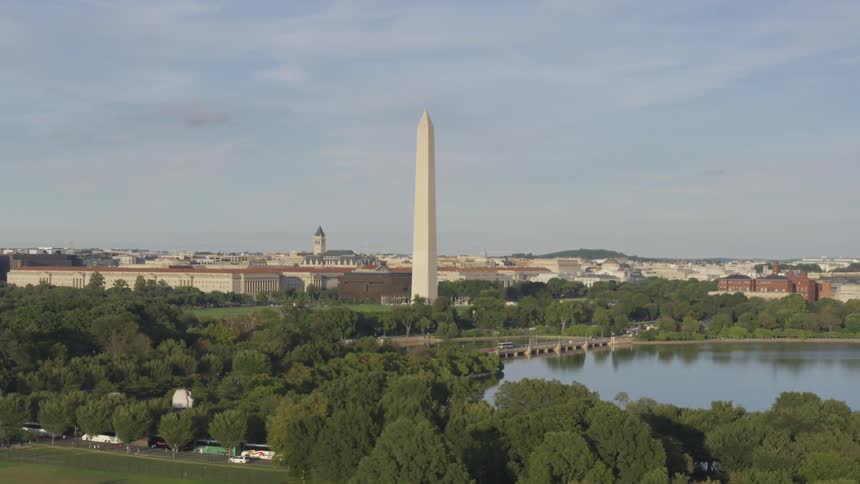 The washington monument looms over the city