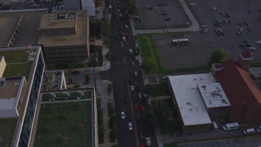Camera flies over a busy city street
