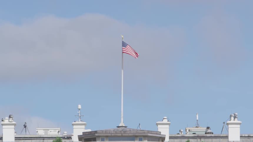 An american flag waving in the sky