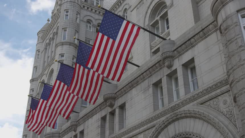 Flags are displayed on a government building