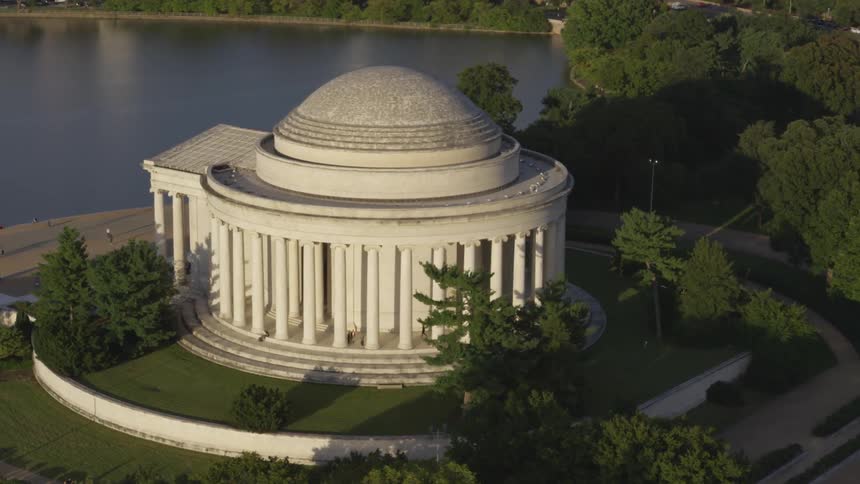 A monument on the edge of a lake