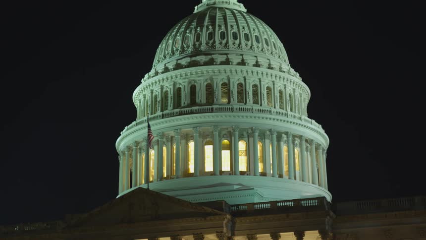 A view of a capitol building at night