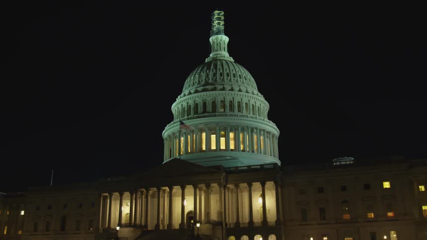 The united states capitol building at night