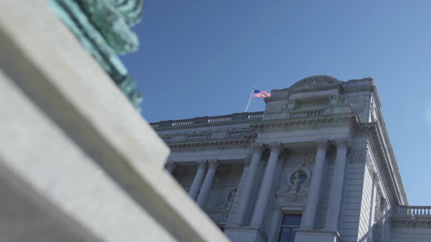 Camera looks up towards an ornate building