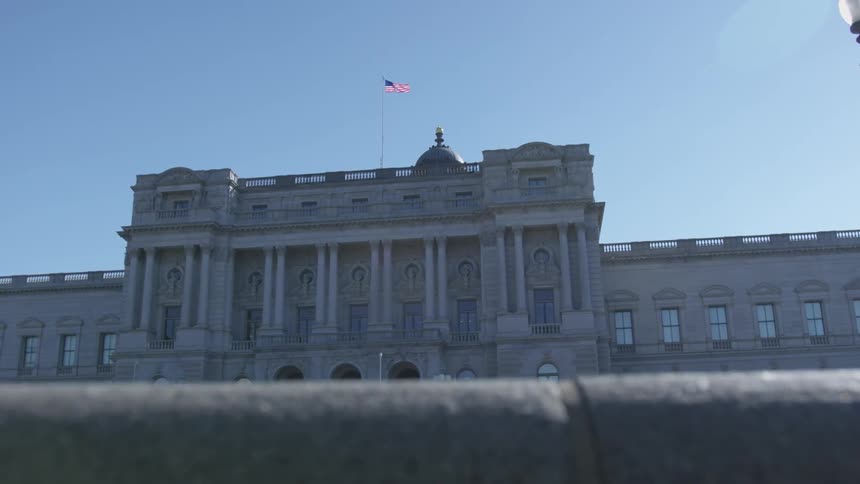 Domed government building with flag flying overhead