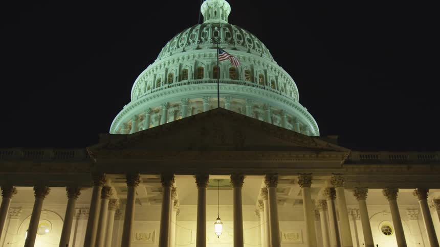 The united states capitol building at night