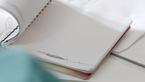 A woman making a paper cartoon