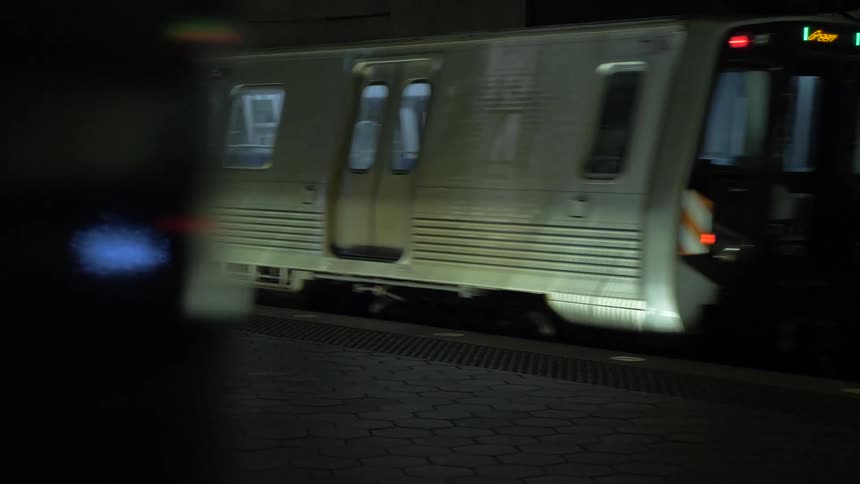 A subway train leaving the train station