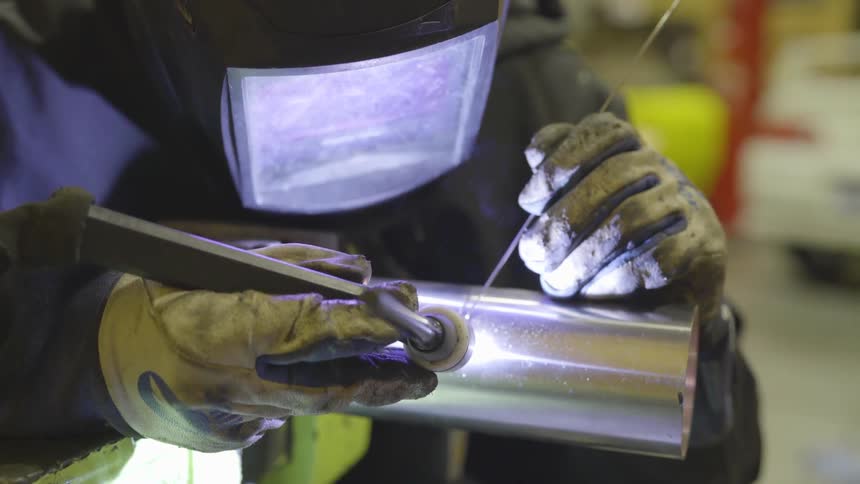 Person welds metal