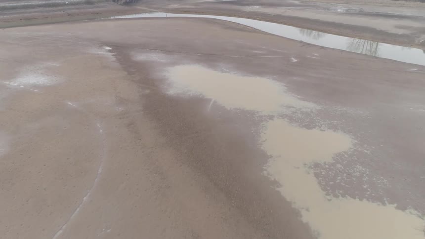 A river runs through barren land