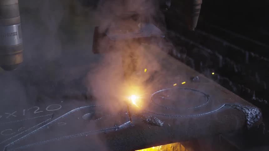 A cutter cutting through metal