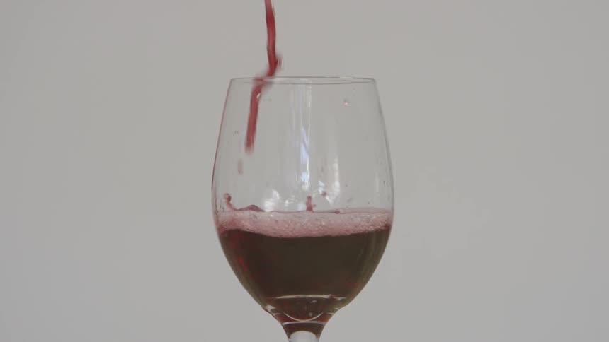 Red wine being poured into a wine glass