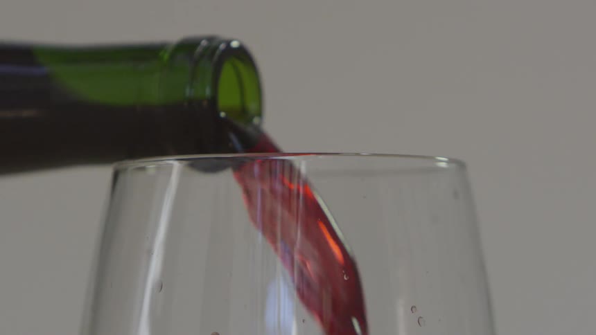 Red wine being poured into a glass