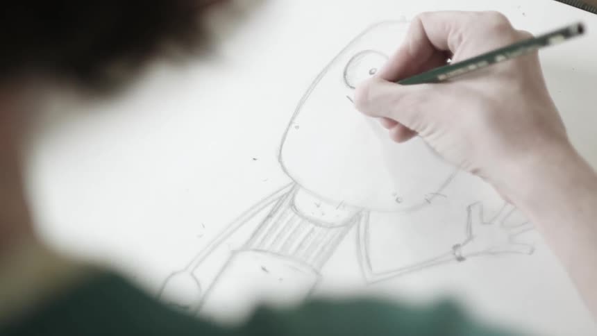 An artist draws a cartoon character