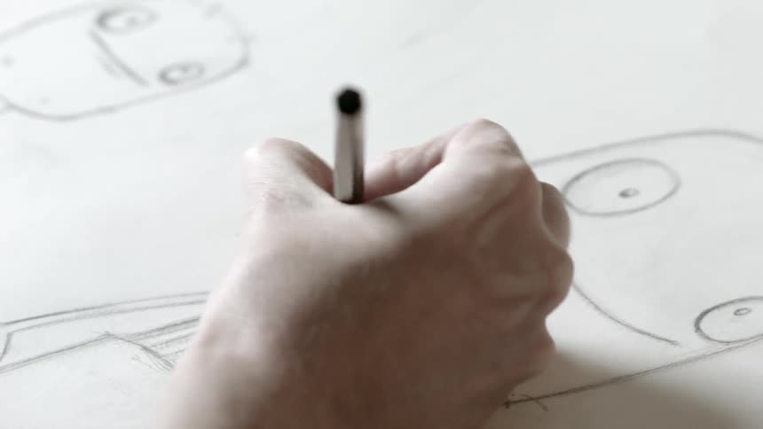 A person drawing with a pencil