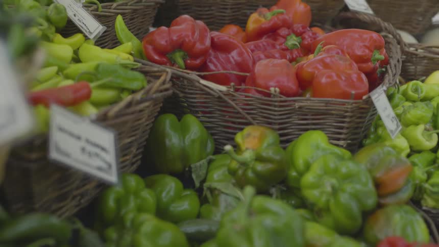 Produce is in baskets at a market