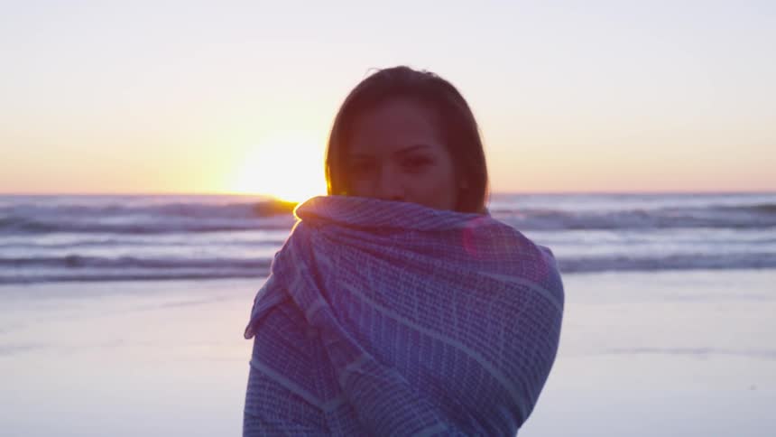 Girl standing next to the beach