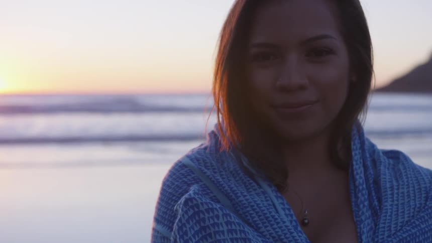 Girl standing next to an ocean