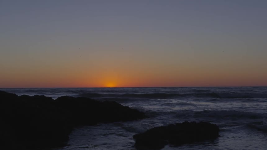 The sun is setting in the horizon