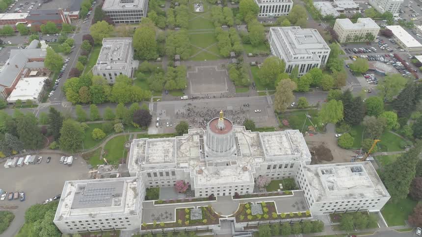 Aerial shot of a government building in a city setting
