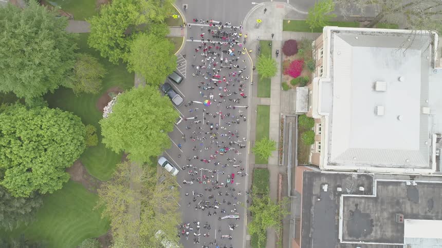 People marching down the main drag